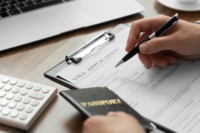 A visa application form and passport