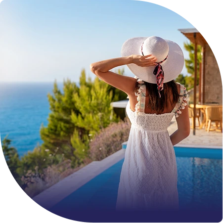 A woman looking out over a swimming pool